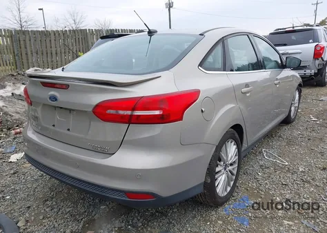 2015 Ford Focus Titanium z USA, uszkodzony, nr VIN 1FADP3J25FL339204